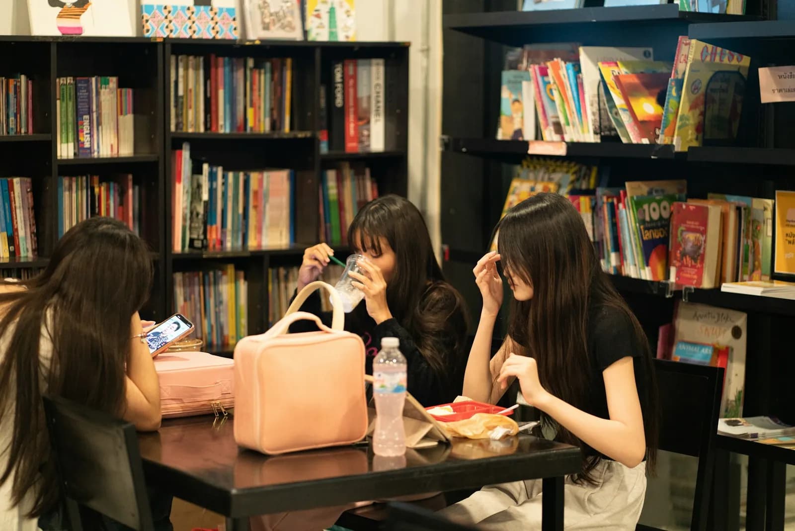 A table among bookshelves